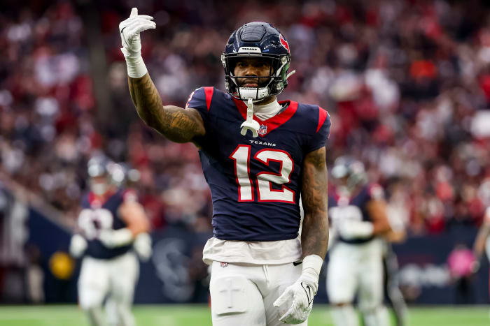Texans wide receiver Nico Collins (12) celebrates catching the ball during the first quarter in a 2024 AFC wild card game at NRG Stadium.
